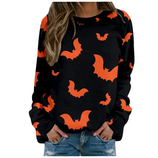Black sweater with orange bat patterns worn by a person on a white background