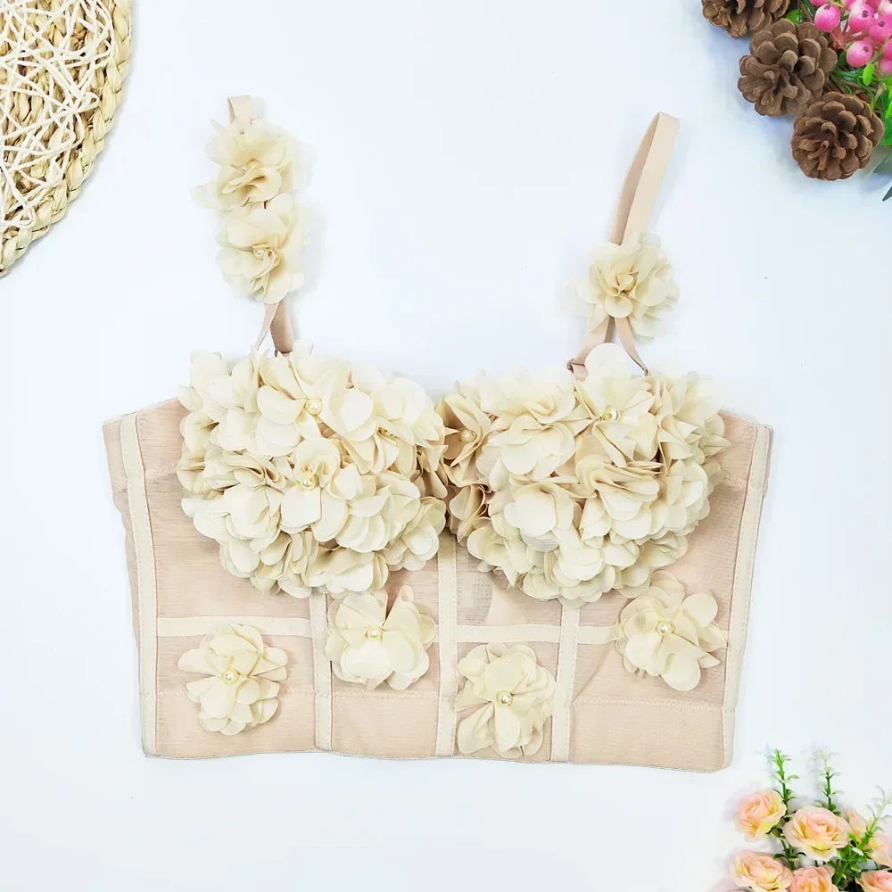 Beige bra with floral embellishments on a white background