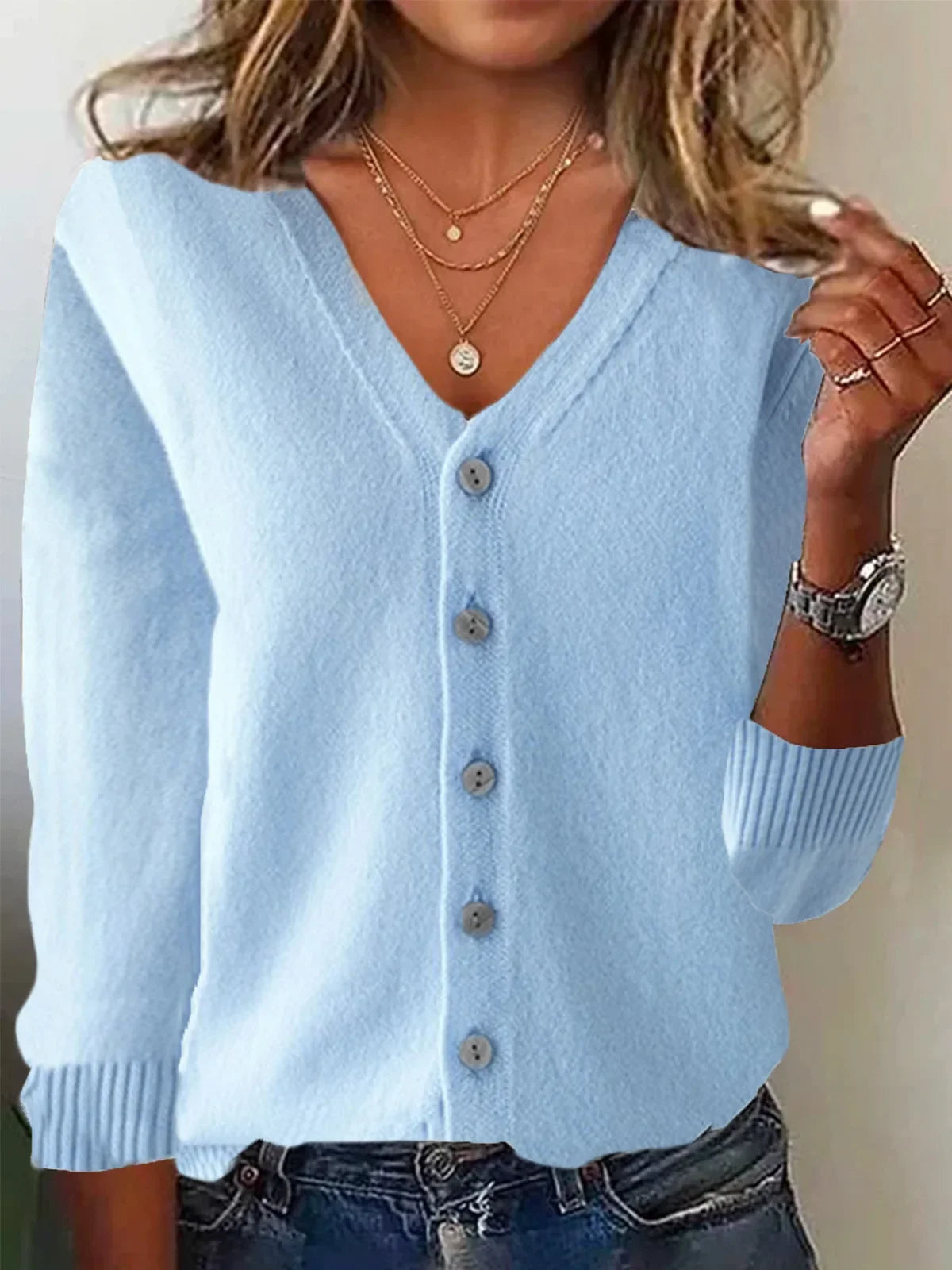 Light blue cardigan worn by a person with a neutral background