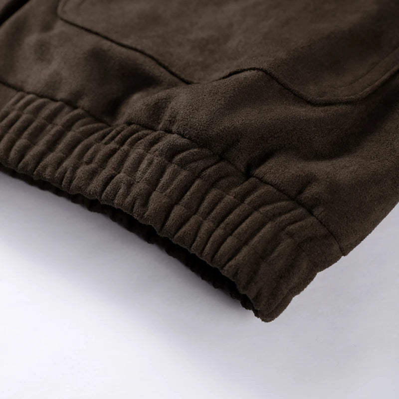Close-up of brown fabric with a textured surface on a white background
