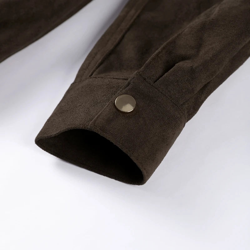 Close-up of a brown fabric sleeve with a button on a white background