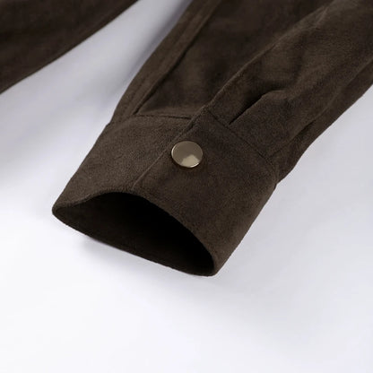 Close-up of a brown fabric sleeve with a button on a white background