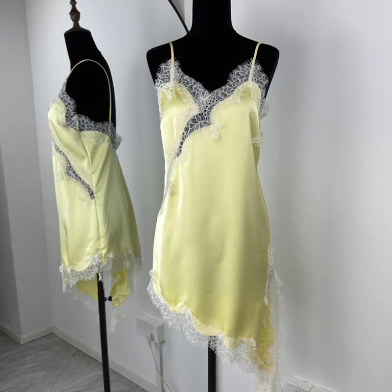 Yellow satin nightgown with lace trim on mannequins against a white background