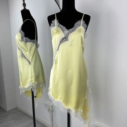 Yellow satin nightgown with lace trim on mannequins against a white background