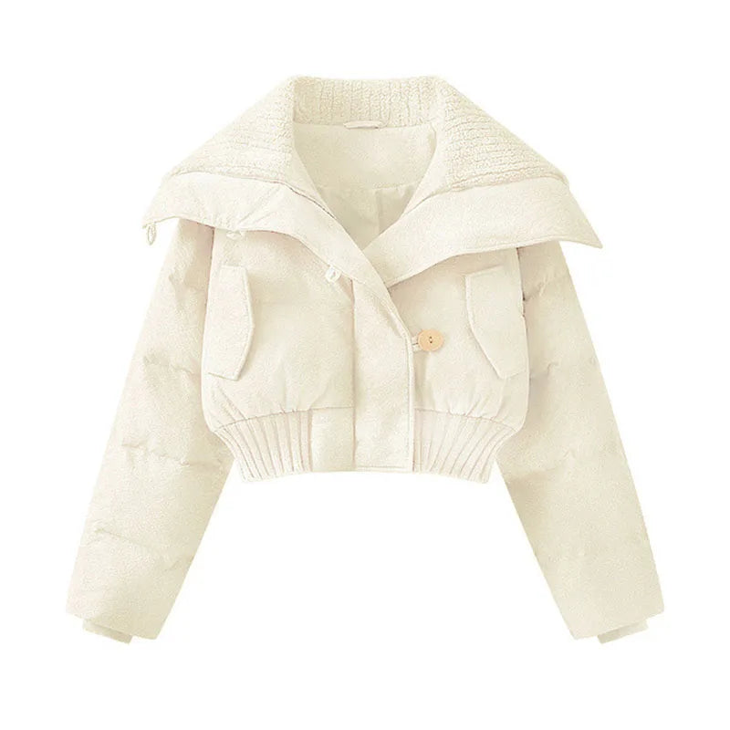 Beige knitted cardigan on a white background