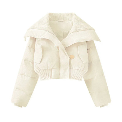 Beige knitted cardigan on a white background