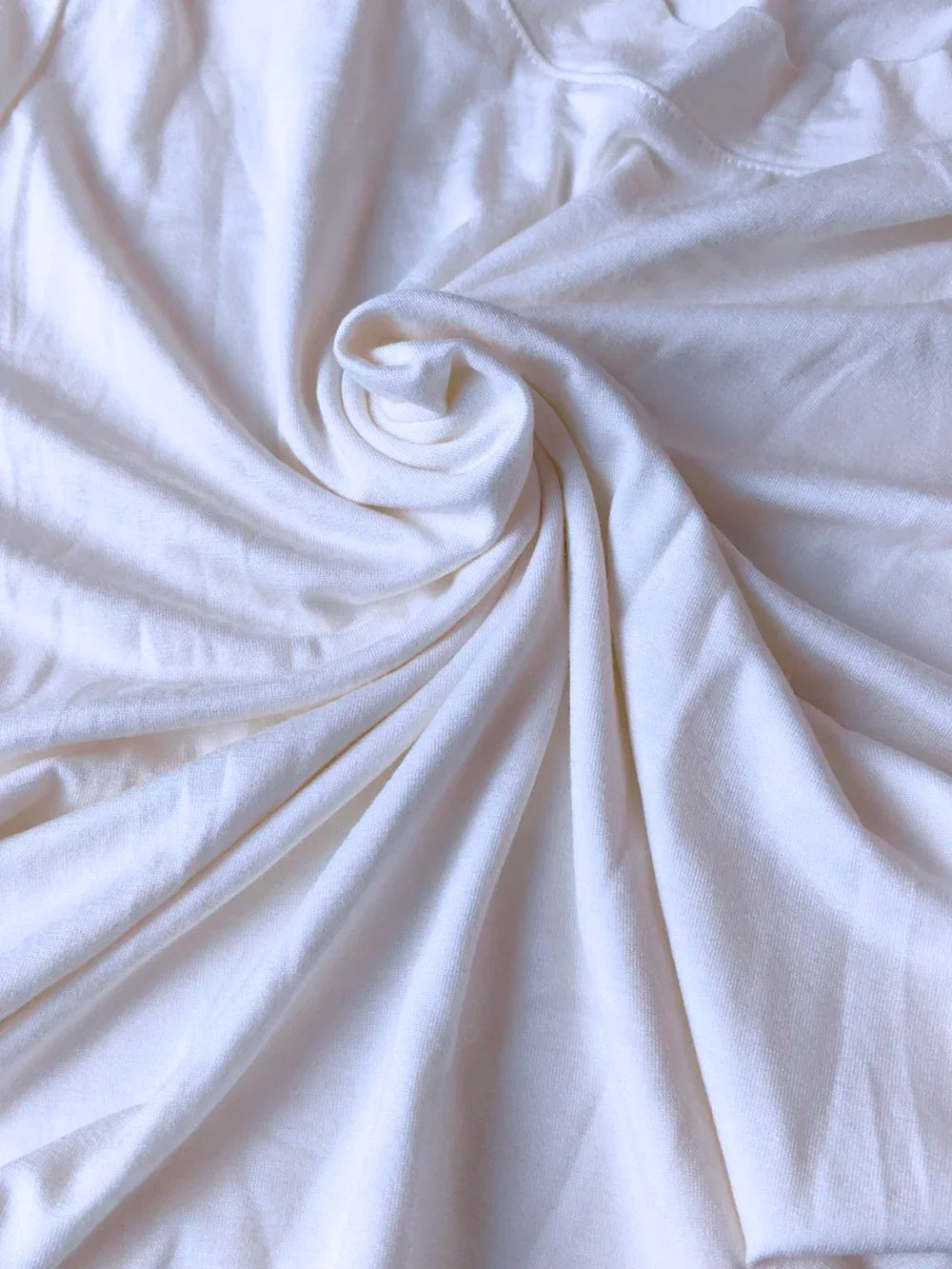 Close-up of white fabric with folds