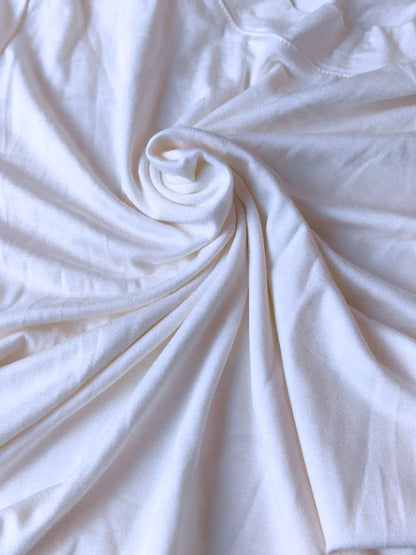 Close-up of white fabric with folds
