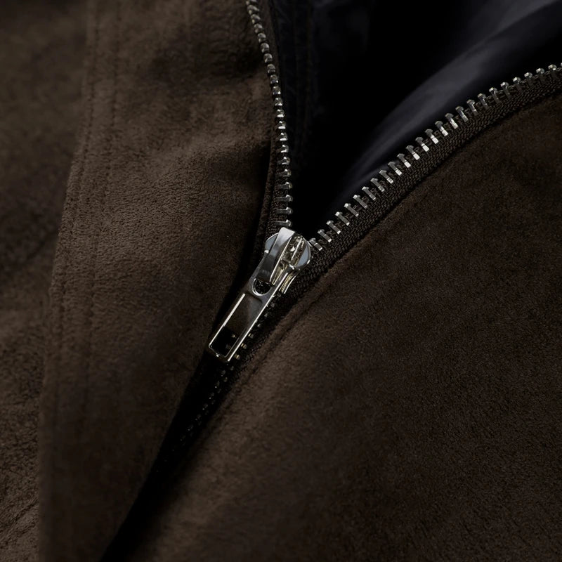 Close-up of a brown jacket with a zipper