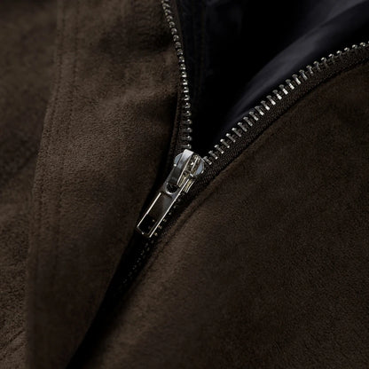 Close-up of a brown jacket with a zipper