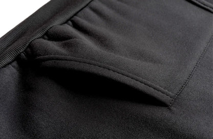 Close-up of black fabric with a focus on texture and stitching detail.