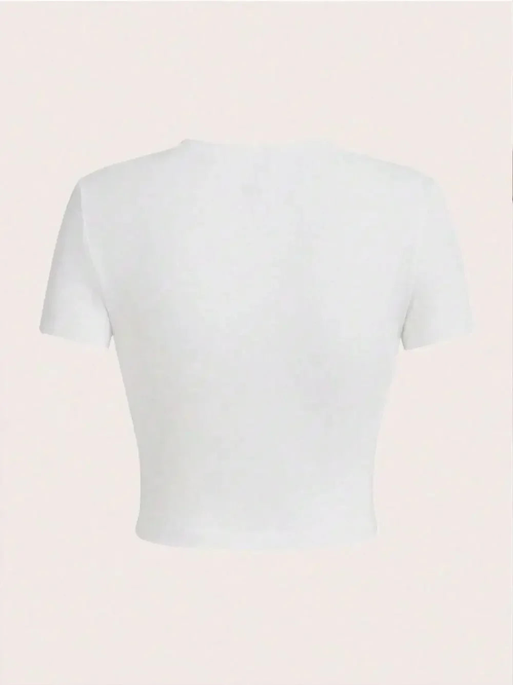 White crop top on a light pink background