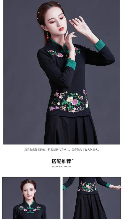 Woman wearing a black top with floral embroidery on a gray background