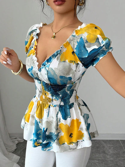 Woman wearing a colorful floral dress with puffed sleeves against a neutral background