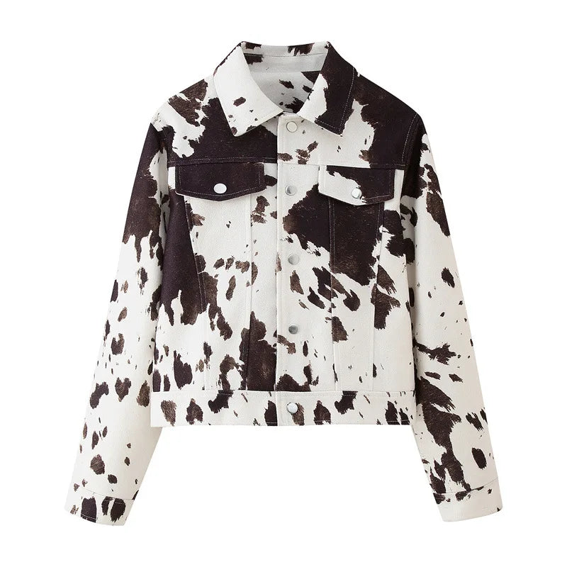 Cow print denim jacket on a white background