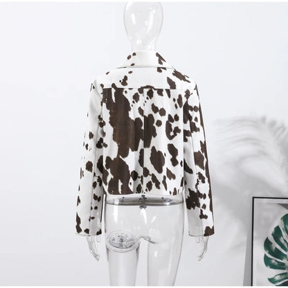 Mannequin wearing a cow print jacket on a white background