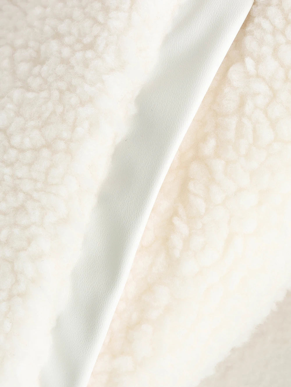 Close-up of a textured white fabric surface