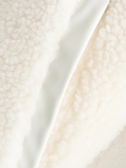 Close-up of a textured white fabric surface