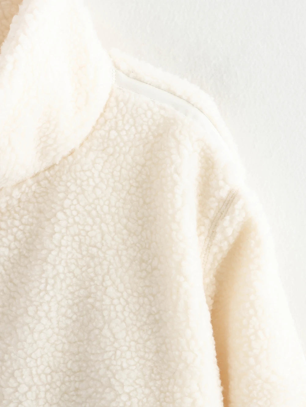 Close-up of a textured beige fabric with a blurred background