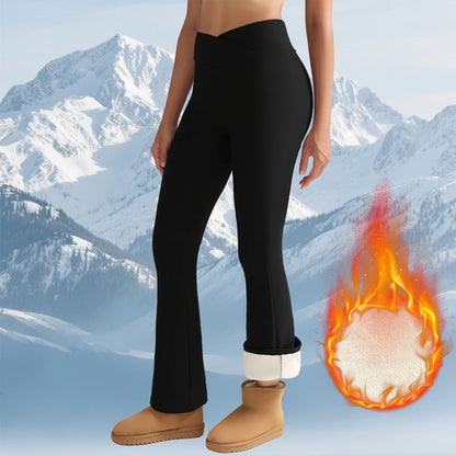 Person wearing black leggings with a mountain background and a cartoon depiction of feet in flames.