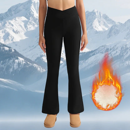 Person wearing black leggings with a fiery graphic and mountainous background