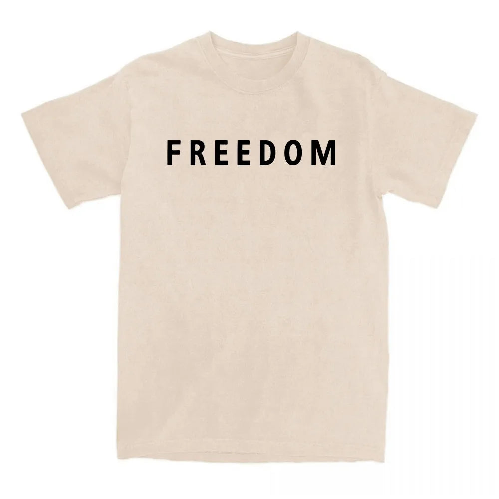 Beige t-shirt with 'FREEDOM' printed in black on a white background