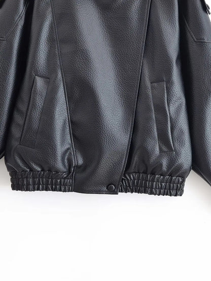Close-up of a black leather jacket on a white background