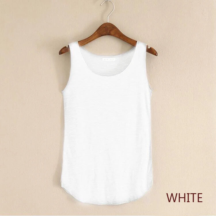 White tank top on a wooden hanger against a beige background
