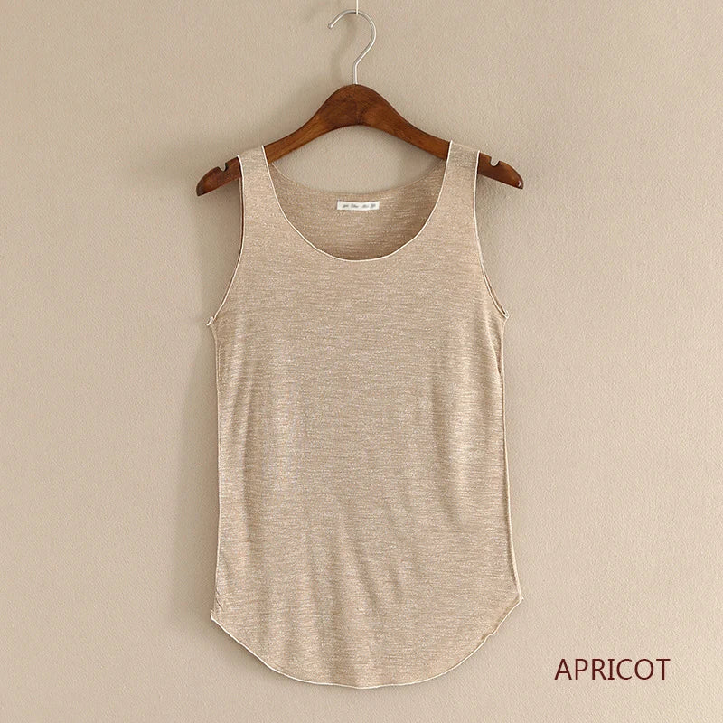 Beige tank top on a wooden hanger against a beige wall with 'APRICOT' text.