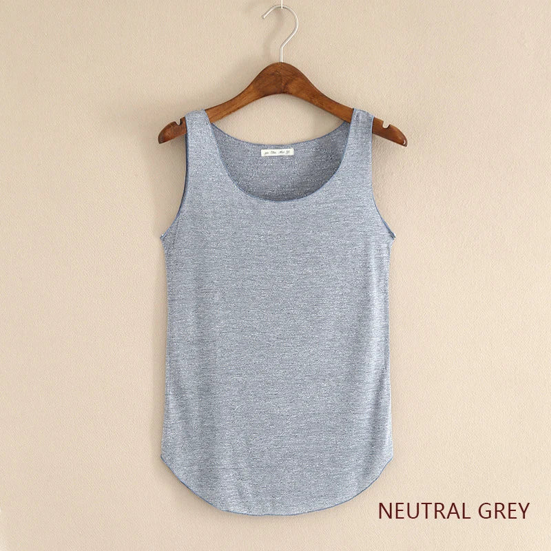 Neatly folded neutral grey tank top on a hanger against a beige background
