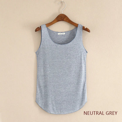 Neatly folded neutral grey tank top on a hanger against a beige background
