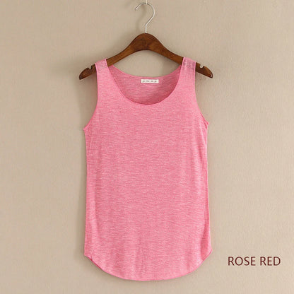 Rose red tank top on a hanger against a beige background