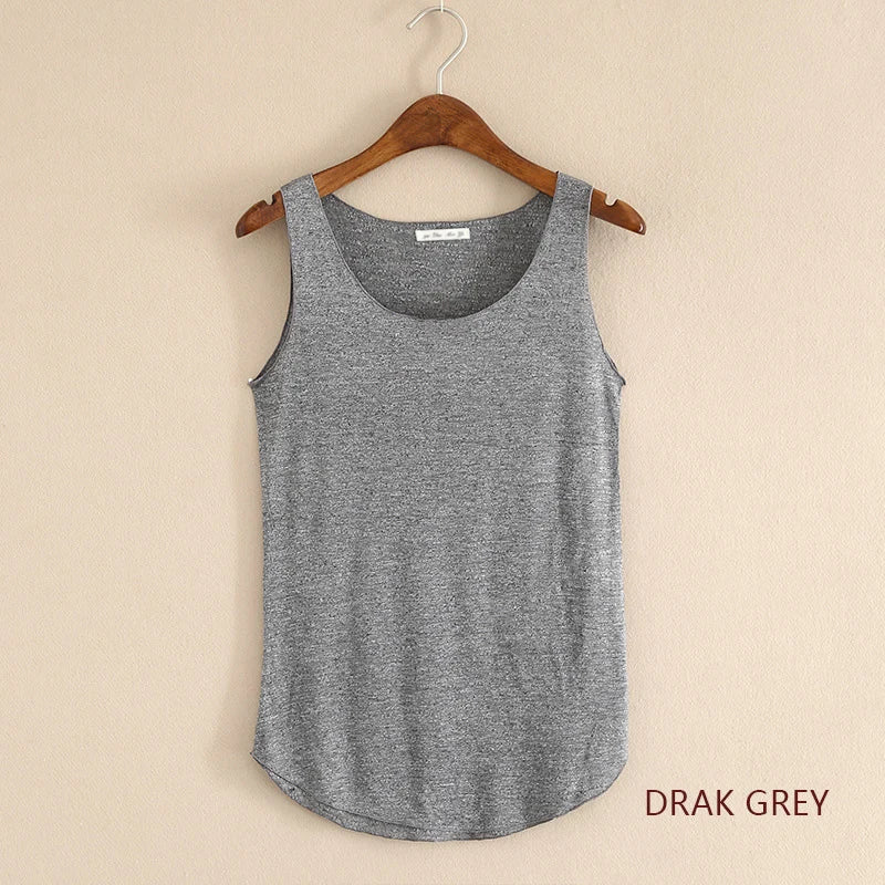Drak Grey tank top on a hanger against a beige wall
