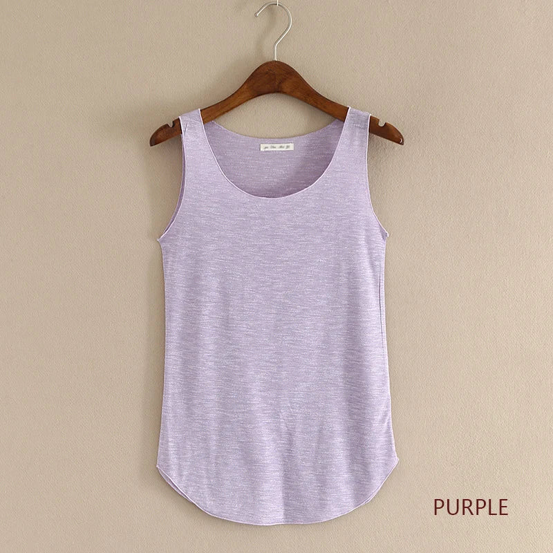 Purple tank top on a wooden hanger against a beige wall