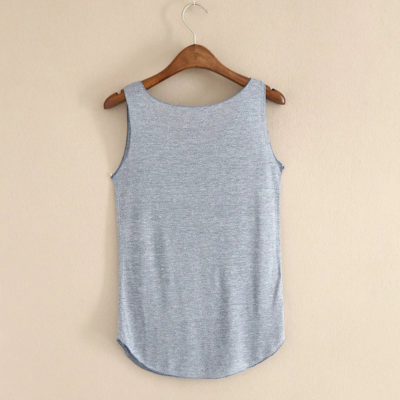 Blue sleeveless shirt on a wooden hanger against a beige background
