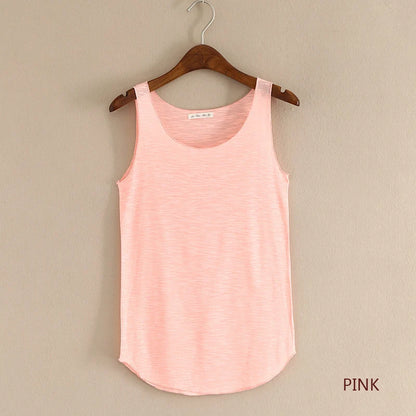 Pink tank top on a wooden hanger against a beige wall with 'PINK' text.