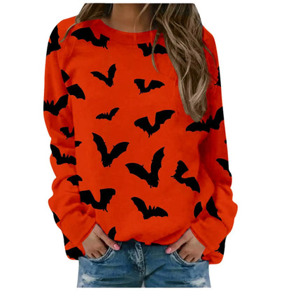 Orange sweatshirt with black bat patterns worn by a person on a white background