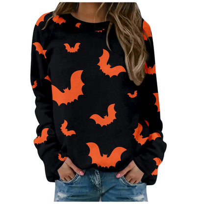 Black sweater with orange bat patterns worn by a person on a white background