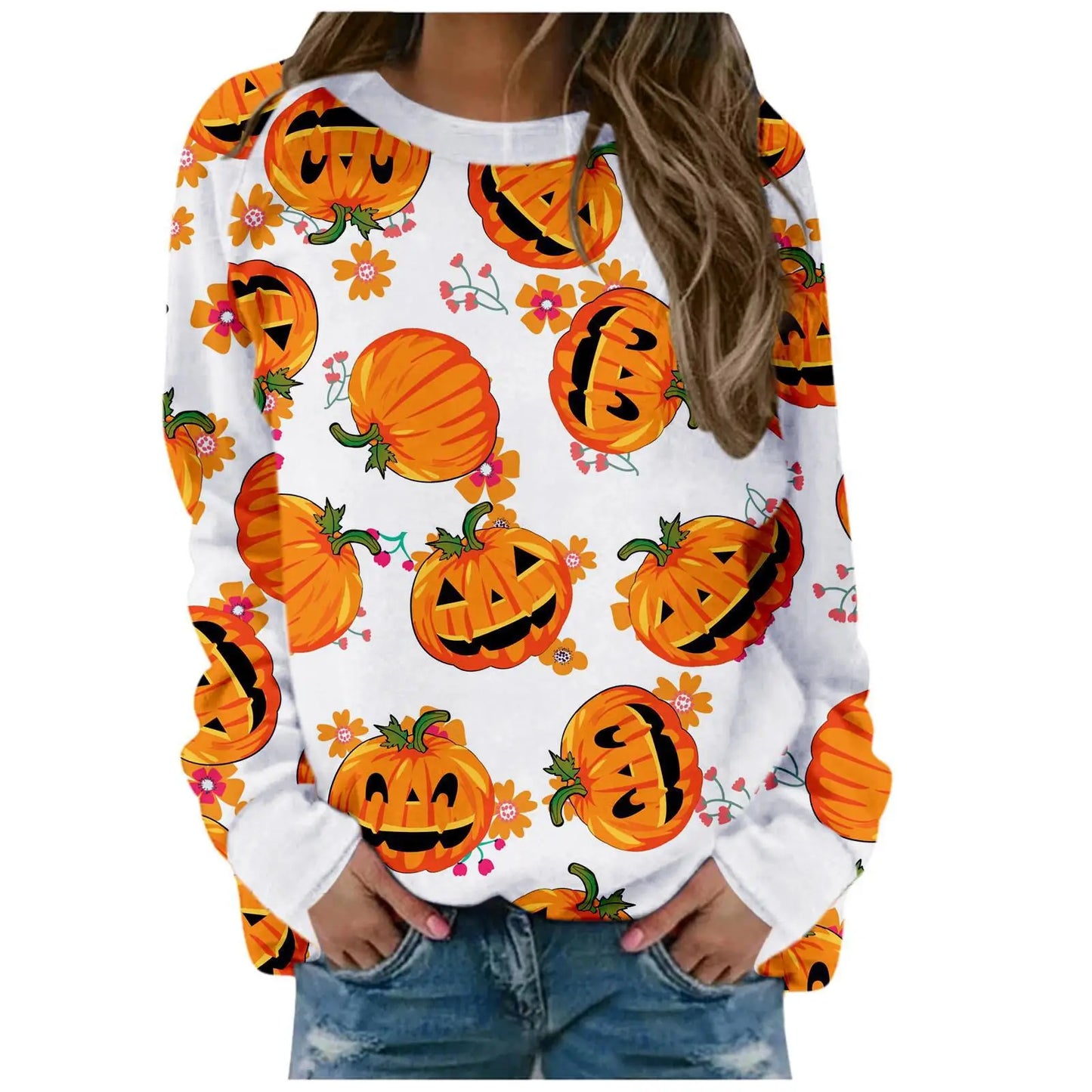 White sweatshirt with orange pumpkin pattern worn by a person on a white background