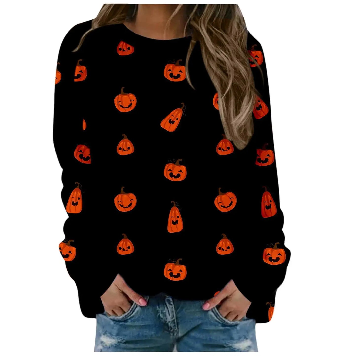 Black sweater with orange pumpkin patterns worn by a person on a white background