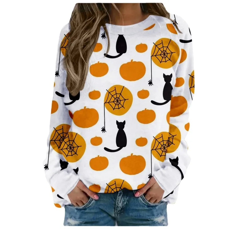 White sweatshirt with Halloween-themed design featuring pumpkins, cats, and spider webs on a white background.