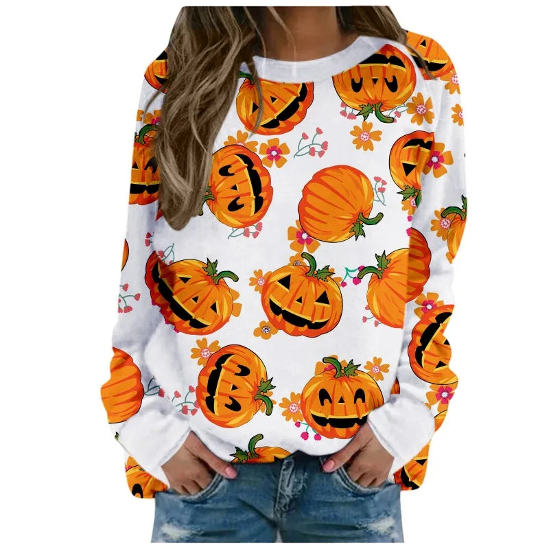 White sweatshirt with Halloween pumpkin print worn by a person on a white background