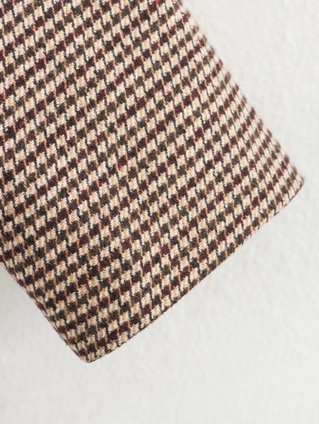 Houndstooth patterned fabric on a white background