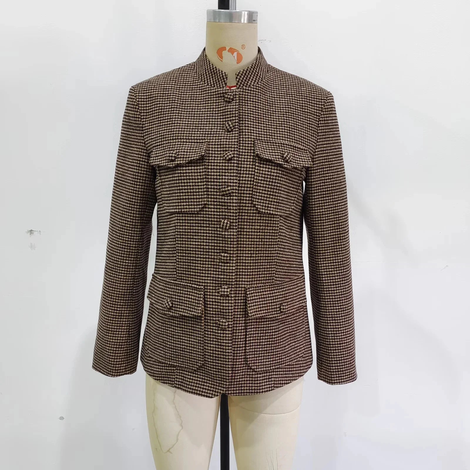 Brown checkered jacket on a mannequin against a white background
