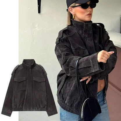 Woman wearing a black jacket with a close-up of the jacket on a white background