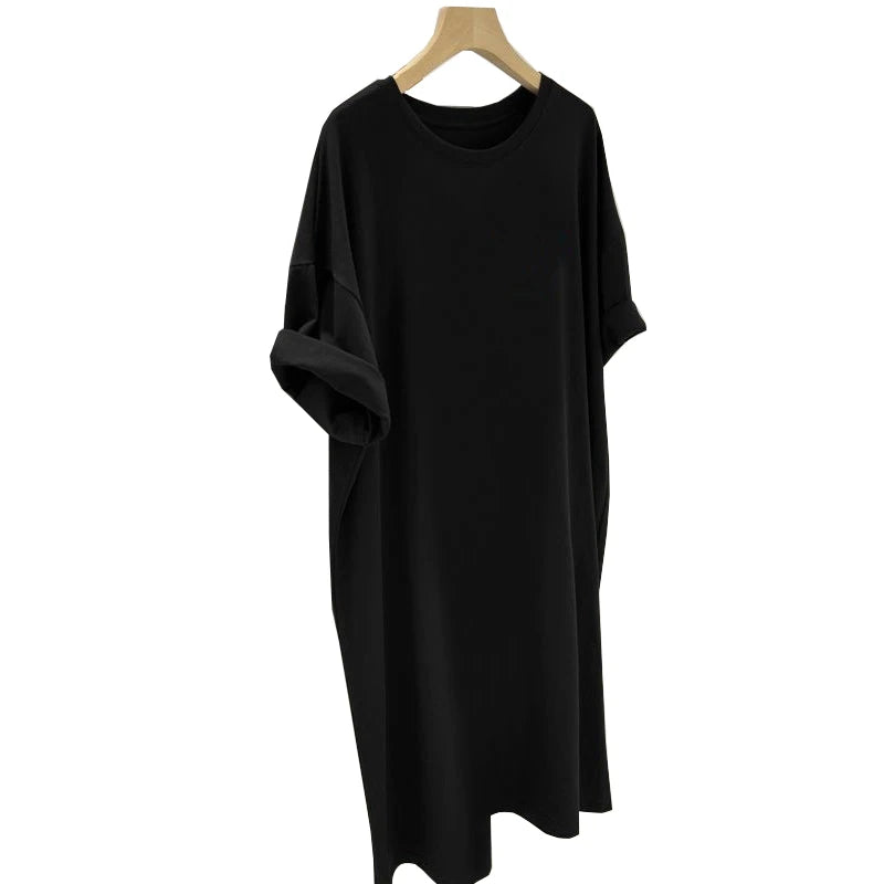 Black dress on a wooden hanger against a white background