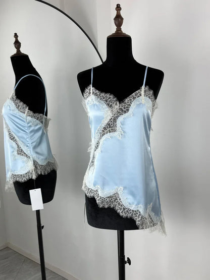 Light blue lace nightgown on a mannequin against a plain background