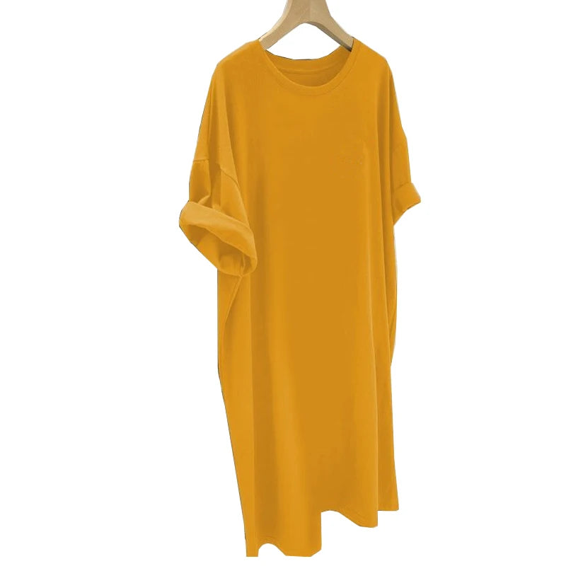Yellow dress on a hanger against a white background