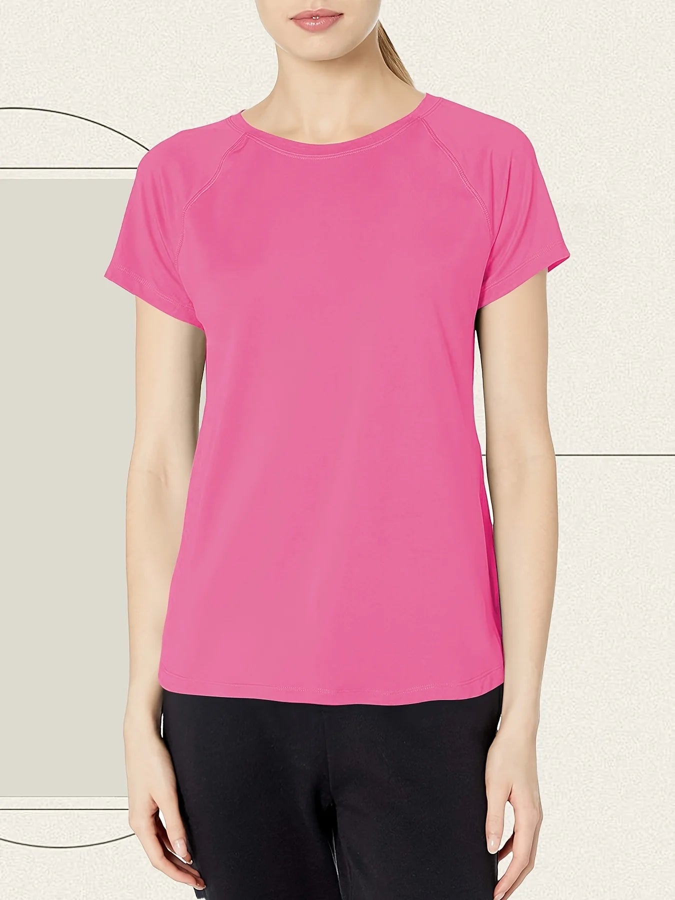 Person wearing a bright pink t-shirt against a neutral background