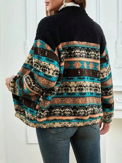 Person wearing a patterned sweater with a black collar against a white background